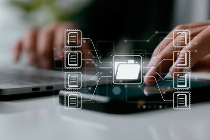 Hands interacting with a digital file management interface